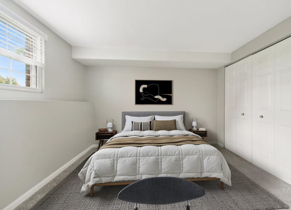 Model Bedroom with Carpet and Closet at Meadows at Marlborough Apartments located in Marlborough, MA.