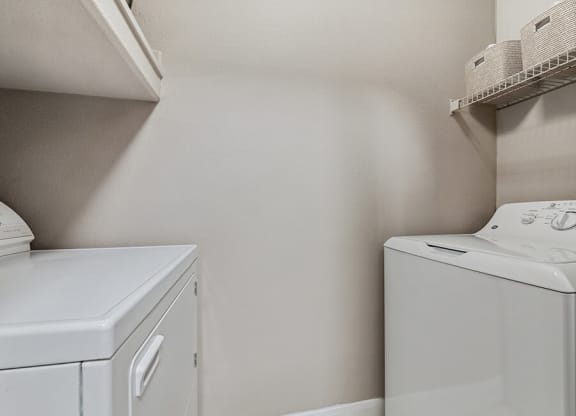 Model Laundry Room with Washer & Dryer at Park West Apartments located in Houston, TX.