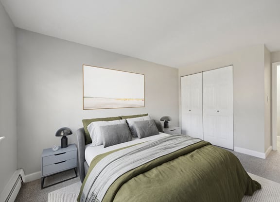 Model Bedroom with Carpet and Hallway View at Middlesex Crossing Apartments in Billerica, MA.