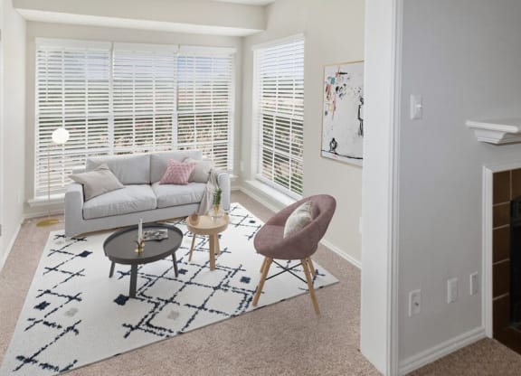 Model living room with large windows at Autumnwood, Arlington