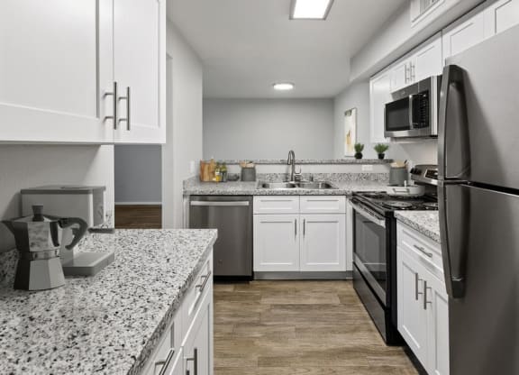 Model kitchen showcasing stainless steel appliances.