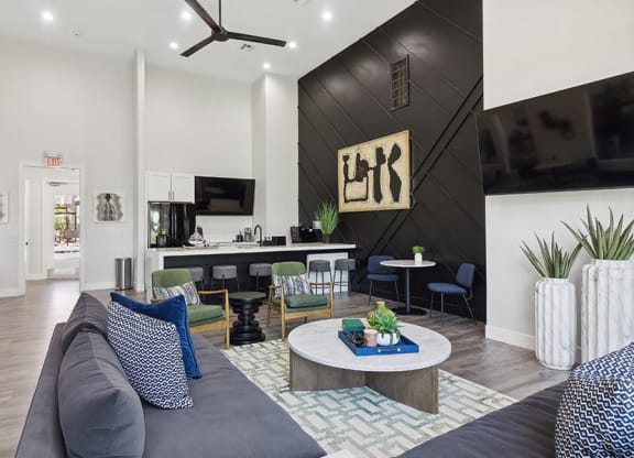 Community Clubhouse with Lounge Furniture, TV & Kitchenette Area at Monterra Apartments located in Las Vegas, NV.