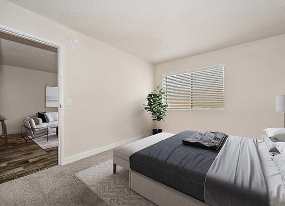 Model Bedroom with Carpet and Large Walk-In Closet at Butler Ridge Apartments located in Glendale, AZ.