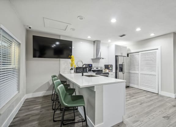 Community Clubhouse with Kitchenette Area and TV at Park at 7200 Apartments in Jacksonville, FL.