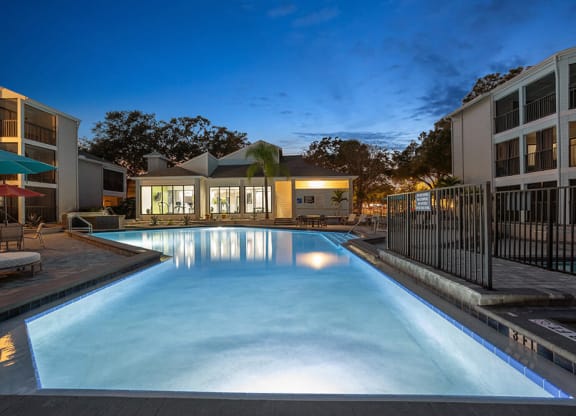 Community Swimming Pool with Pool Furniture at Haven at Water's Edge Apartments in Tampa, FL.