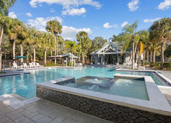 Community Hot Tub and Pool View at Caribbean Breeze Apartments in Tampa, FL.