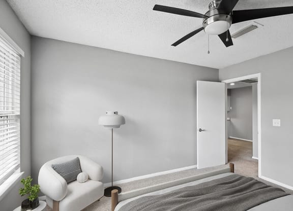 Model Bedroom with Carpet and Window View at Abbington Heights Apartments in Antioch, TN.
