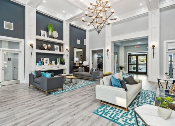 Community lounge with sofas at Park West Apartments in Houston, Texas