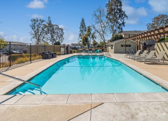 Community Pool & Pool Furniture at Forest Park Apartments in El Cajon, CA.