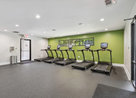 Community Fitness Center with Treadmills and Water Fountain at Dunwoody Village Apartments in Atlanta, GA.