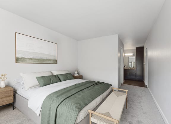 Model Bedroom with Carpet at Creek at 2645 Apartments located in Sacramento, CA.