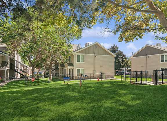 Community Dog Park with Agility Equipment at Broadmoor Village Apartments located in West Jordan, UT.