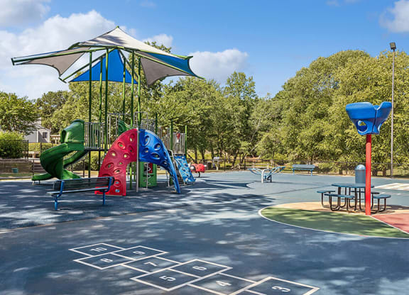Community Playground with a Canopy at Lakeside Retreat Apartments located in Peachtree Corners, GA.