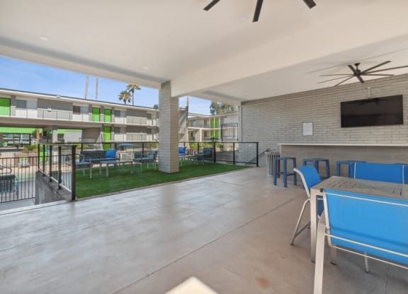 Covered outdoor lounge space near pool