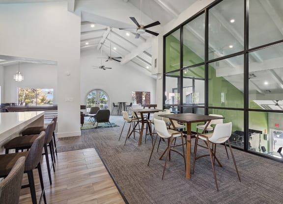 Community Clubhouse with Lounge Furniture and Kitchenette Area at Meadow Ridge Apartments located in Las Vegas, NV.