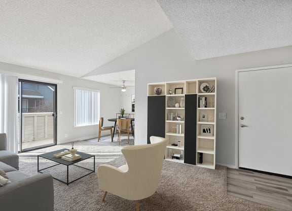 Model Living Room with Carpet and Patio Accessibility at Bridges on Sunset Apartments in Suisun City, CA.