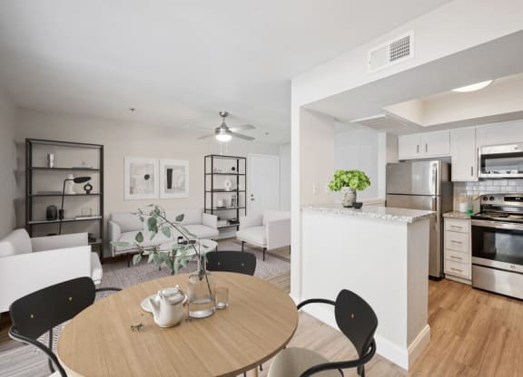 Model dining space and view of kitchen