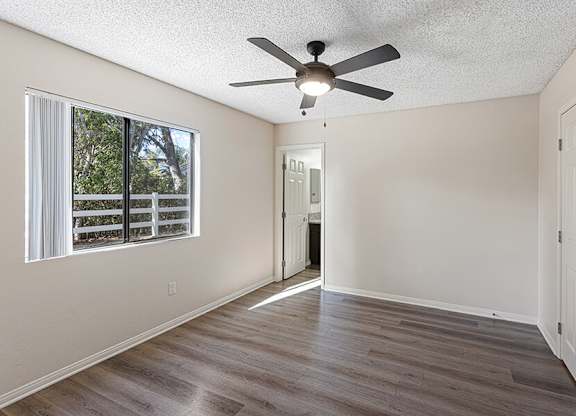 Model Bedroom with Wood-Style Flooring at Santa Fe Ranch Apartments located in Carlsbad, CA.