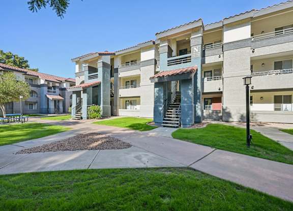 Sunny day at the Stillwater Apartment swith a clear blue sky.