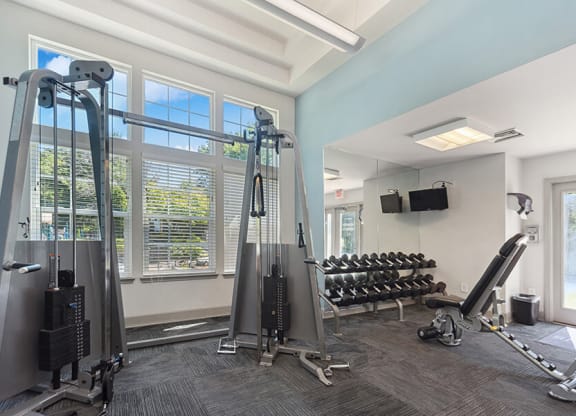 Community Fitness Center with Equipment and TV's at The Commons at Haynes Farm Apartments in Boston, MA.