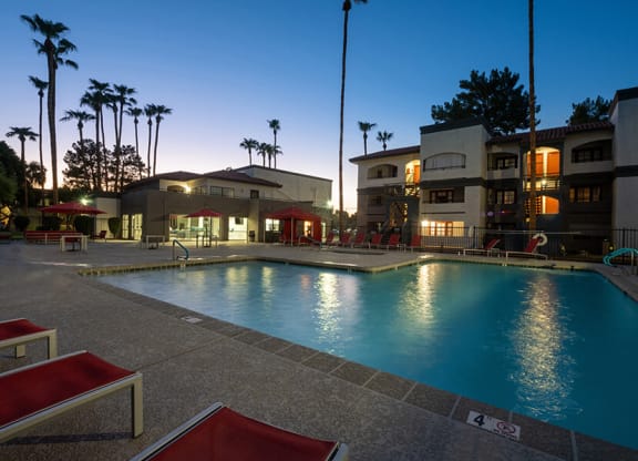 Community Swimming Pool with Pool Furniture at Country Club Verandas Apartments located in Mesa, AZ.