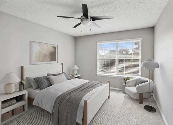 Model Bedroom with Carpet and Window View at Abbington Heights Apartments in Antioch, TN.