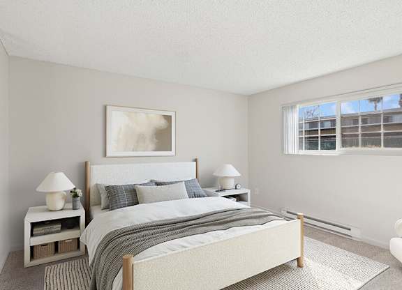 Model Bedroom with Carpet and Window View at Los Gatos Landing Apartments located in San Jose, CA.