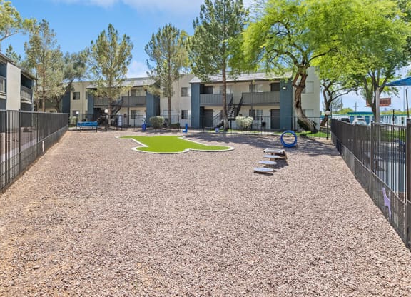 Community Dog Park with Agility Equipment at Solano Springs Apartments in Tucson, AZ.
