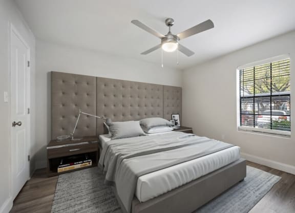 Model bedroom with window and fan
