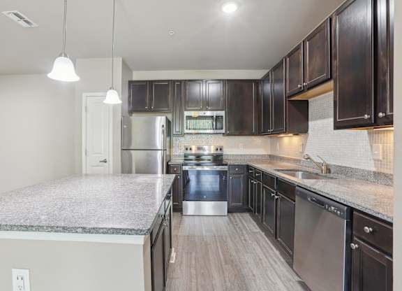Model kitchen with stainless steel appliances.
