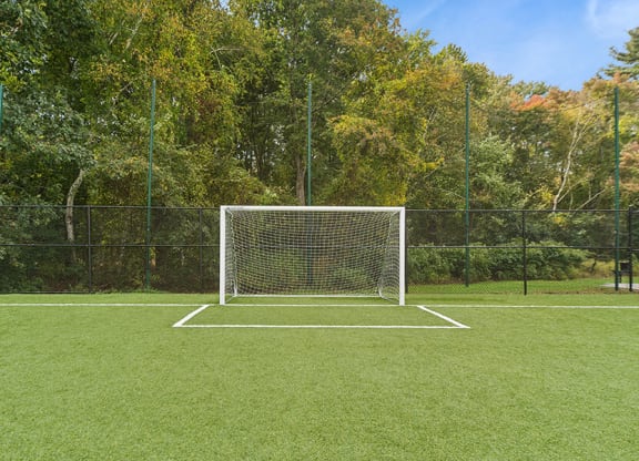 Community Soccer Field with Nets at Meadows at Marlborough Apartments located in Marlborough, MA.