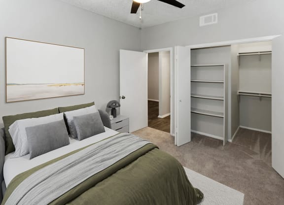 Model Bedroom with Carpet and Closet at Dallas North Park Apartments in Dallas, TX.