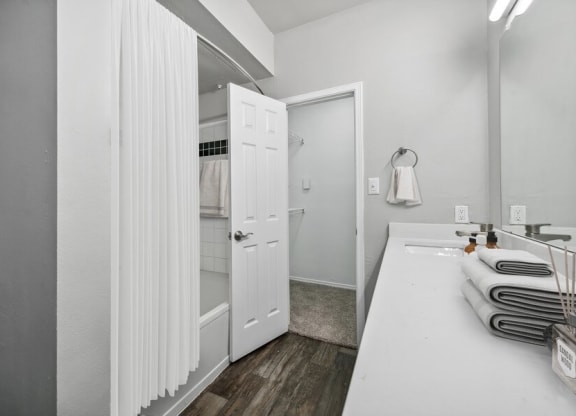 Model bathroom and hallway at Bridges at Oakbend, Lewisvillle, 75067