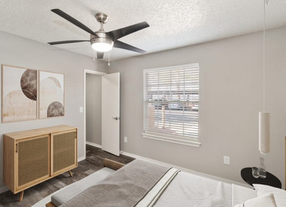 Model bedroom showcasing large windows