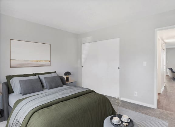Model Bedroom with Carpet and Closet at Overlook Point Apartments in Salt Lake City, UT.