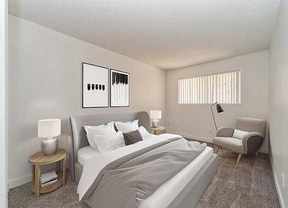 Model Bedroom with Carpet and Window View at Palmilla Apartments located in San Diego, CA.