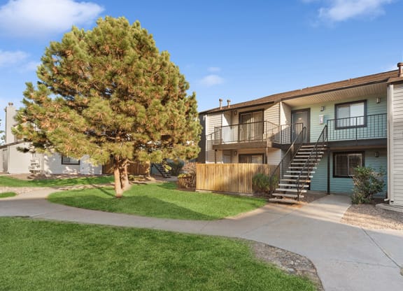 Exterior Community Building and Landscape at Liberty Creek Apartments in Aurora, CO.