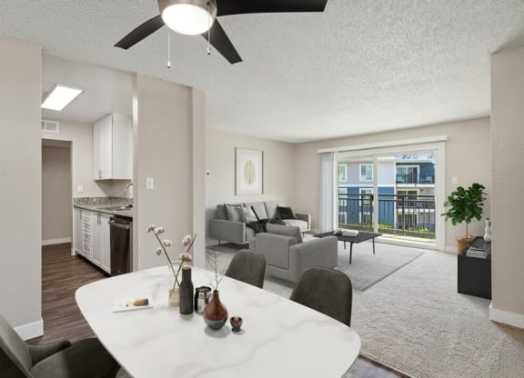 Model kitchen and living room with a ceiling fan