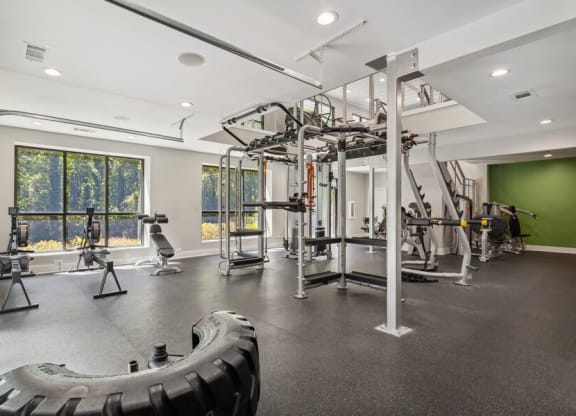 Community Fitness Center with Equipment and Upstairs Area at Dunwoody Village Apartments in Atlanta, GA.
