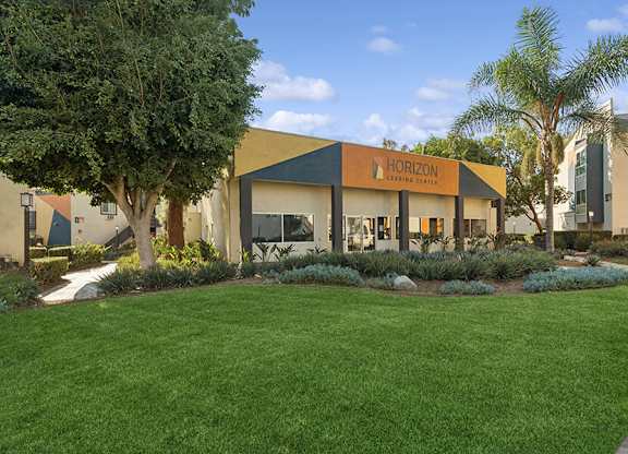 Exterior Community Building and Landscape at Horizon Apartments located in Santa Ana, CA.