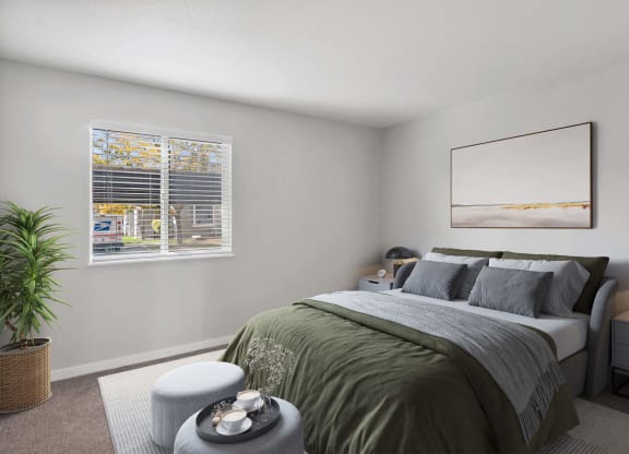 Model Bedroom with Carpet and Window View at Overlook Point Apartments in Salt Lake City, UT.