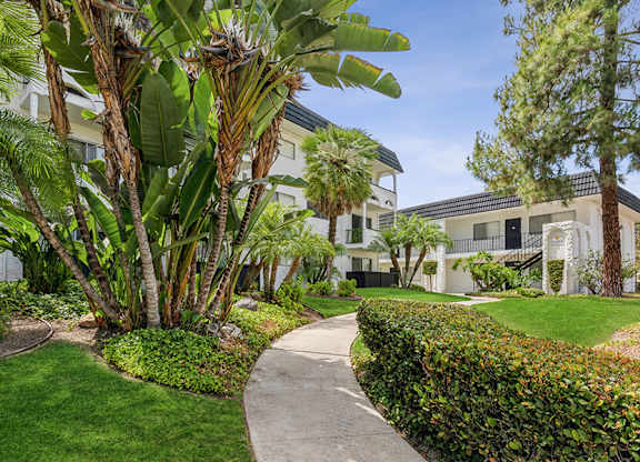 Exterior Community Building and Landscape at Palmilla Apartments located in San Diego, CA.