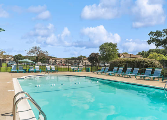 Community Swimming Pool with Pool Furniture at Meadows at Marlborough Apartments in Boston, MA.