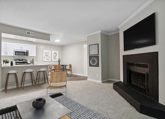 Model Living Room and Dining Room Area with Kitchen View at Arbor Village Apartments in Charlotte, NC.
