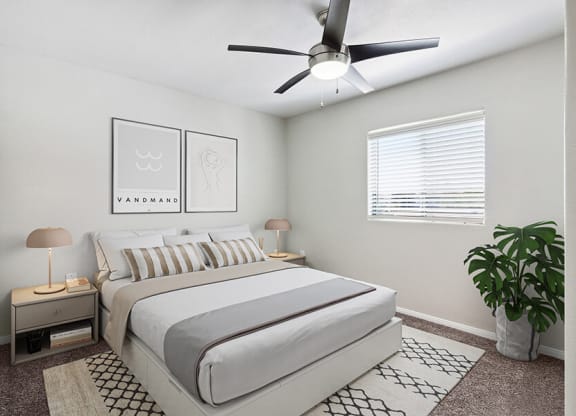 Model Bedroom with Carpet and Window View at Loma Vista Apartments in Las Vegas, NV.