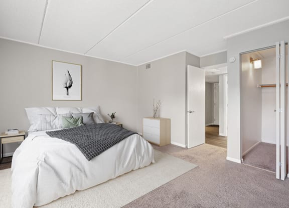 Model Bedroom with Carpet, Closet & Hallway View  at Elevate on Parkway, Burnsville