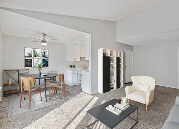 Model Living Room with Carpet and View of Dining Room at Bridges on Sunset Apartments in Suisun City, CA.