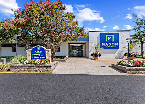 The front of a building with a sign that says Mason on it.