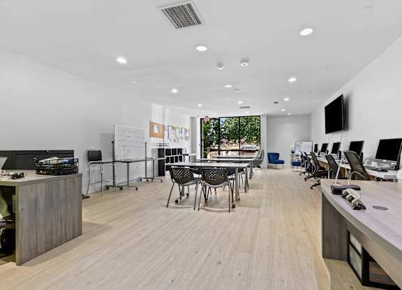 A modern office space with wooden floors and furniture.