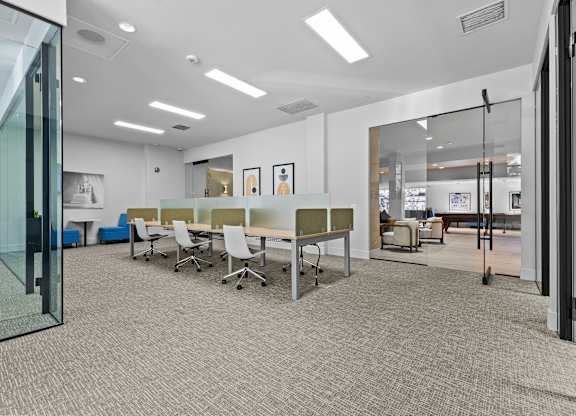 A conference room with a table and chairs.